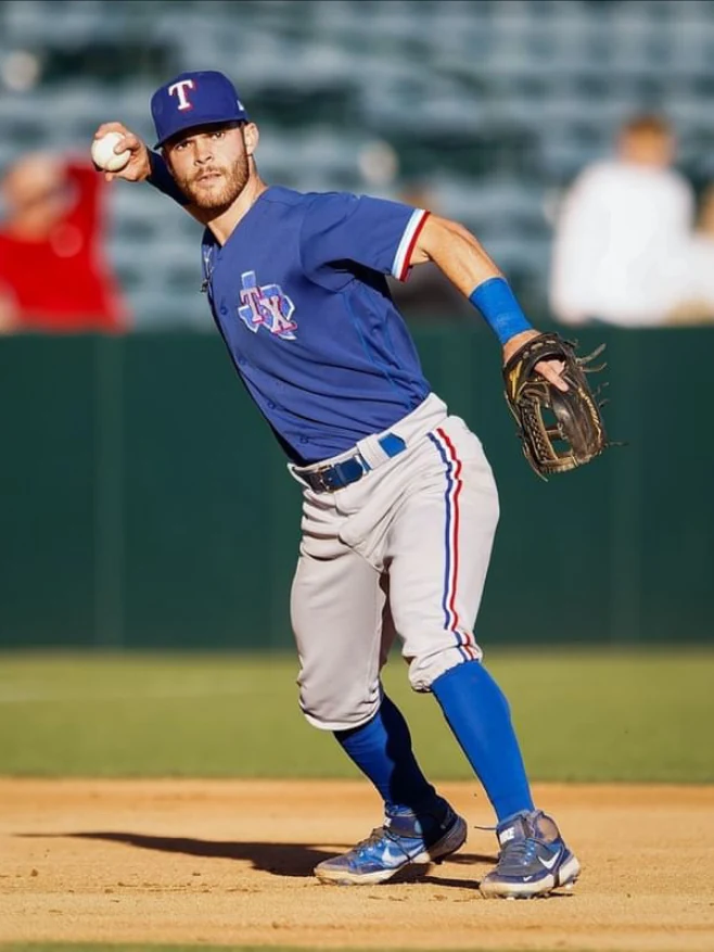 Griffin Cheney fielding, in a Texas Rangers uniform.